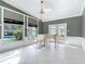 Elegant living room with decorative windows providing ample natural light and views of the pool at 3417 Pershing Ave, Orlando, FL 32812