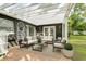 Relaxing outdoor patio area with comfortable seating, neutral color scheme, and a charming pergola at 3417 Pershing Ave, Orlando, FL 32812