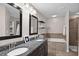 Spacious bathroom with double vanity sinks, soaking tub, and glass-enclosed shower at 3472 Gretchen Dr, Ocoee, FL 34761