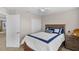 Comfortable bedroom features a ceiling fan, neutral walls and a wood bedside table at 3472 Gretchen Dr, Ocoee, FL 34761
