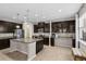 Spacious kitchen featuring dark cabinets, stainless appliances, a large island and ample counter space at 3472 Gretchen Dr, Ocoee, FL 34761