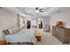Main bedroom featuring carpet, ceiling fan, storage bench, dresser, and dual closets at 3472 Gretchen Dr, Ocoee, FL 34761