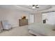 Spacious main bedroom with ceiling fan, carpet, en-suite bath, dresser and ample room at 3472 Gretchen Dr, Ocoee, FL 34761