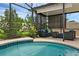 Enjoy this screened-in pool and outdoor seating area with stylish furniture and lush landscaping at 3472 Gretchen Dr, Ocoee, FL 34761