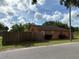 Exterior view of home showing side yard, fence, and the street at 3700 Washington St, Sanford, FL 32771