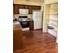 Traditional kitchen showcasing ample cabinet space and essential appliances on hardwood floors at 3700 Washington St, Sanford, FL 32771