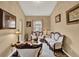 Inviting living room featuring elegant seating, neutral walls, and decorative accents at 501 Lake Cummings Way, Lake Alfred, FL 33850