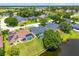 Aerial view shows the privacy of a backyard pool and fenced lawn near the water at 533 Quail Down Dr, Debary, FL 32713
