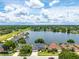Picturesque lakefront homes with mature landscaping and views of the community at 533 Quail Down Dr, Debary, FL 32713