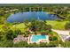 Overhead image of the pool and lake, with the golf course visible in the background of this community at 533 Quail Down Dr, Debary, FL 32713