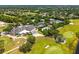 An aerial view showcases the country club's manicured golf course and inviting swimming pool at 533 Quail Down Dr, Debary, FL 32713