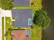 A bird's eye view shows a home with screened lanai and in-ground pool at 533 Quail Down Dr, Debary, FL 32713