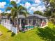 A private, screened in patio with an in-ground pool and outdoor seating at 533 Quail Down Dr, Debary, FL 32713