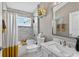This bathroom has tile floors, a shower with curtain, and a vanity with marble countertops at 533 Quail Down Dr, Debary, FL 32713