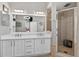 This bathroom features a double vanity and walk-in shower with glass door at 533 Quail Down Dr, Debary, FL 32713