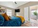 Bedroom featuring a comfortable blue bed and an open doorway at 533 Quail Down Dr, Debary, FL 32713