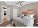 Comfortable bedroom featuring a plush, upholstered headboard and soft, neutral-toned bedding at 533 Quail Down Dr, Debary, FL 32713