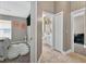 Hallway featuring neutral walls, tiled flooring, with access to a bedroom and bathroom at 533 Quail Down Dr, Debary, FL 32713