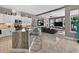 Open-concept kitchen with white cabinetry, a large island, and seamless access to the living area at 533 Quail Down Dr, Debary, FL 32713