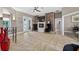 Open-concept living room features a modern fireplace and access to the pool area at 533 Quail Down Dr, Debary, FL 32713