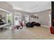 Open living area with neutral tones, tiled flooring, and a view of the home's entry at 533 Quail Down Dr, Debary, FL 32713