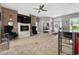 Open-concept living room featuring a fireplace and access to other rooms at 533 Quail Down Dr, Debary, FL 32713