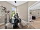 Modern home office featuring wood-look floors, stylish décor, and plenty of natural light at 533 Quail Down Dr, Debary, FL 32713