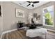 Well-lit office space with stylish decor, wood floors, and views of lush greenery at 533 Quail Down Dr, Debary, FL 32713