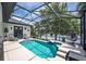 Inviting screened-in pool area with lake views at 533 Quail Down Dr, Debary, FL 32713