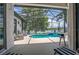 Relaxing screened-in pool area with lake views at 533 Quail Down Dr, Debary, FL 32713