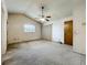 A large bedroom with natural light, ceiling fan, and sliding door access at 5409 Holtland Dr, Apopka, FL 32712