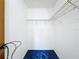 A basic closet features shelving, blue carpet, and white walls at 5409 Holtland Dr, Apopka, FL 32712