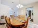 Bright dining area adjacent to kitchen, featuring tile flooring and an open layout at 5409 Holtland Dr, Apopka, FL 32712