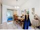 Inviting dining room with tile floors and a sliding door to the screened in porch at 5409 Holtland Dr, Apopka, FL 32712
