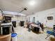 An open garage with overhead door and storage area at 5409 Holtland Dr, Apopka, FL 32712