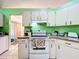 Efficient kitchen with white appliances, ample cabinet space, and a bright, clean design at 5409 Holtland Dr, Apopka, FL 32712