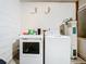 Laundry room area featuring a washer, dryer, and water heater at 5409 Holtland Dr, Apopka, FL 32712