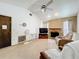 Comfortable living room with a brick fireplace and vaulted ceiling for a cozy feel at 5409 Holtland Dr, Apopka, FL 32712