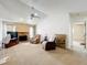 Comfortable living room with a brick fireplace and vaulted ceiling for a cozy feel at 5409 Holtland Dr, Apopka, FL 32712