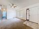 Open living area with natural light, neutral walls, and a view of the front entrance at 5409 Holtland Dr, Apopka, FL 32712
