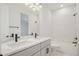 Bathroom featuring double sinks, a vanity, tub, and tiled shower at 5908 Sw 115 Street Rd, Ocala, FL 34476