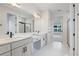 Bright bathroom featuring double sinks, a vanity, and tiled flooring at 5908 Sw 115 Street Rd, Ocala, FL 34476