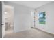 Bright bedroom featuring neutral carpet and large windows at 5908 Sw 115 Street Rd, Ocala, FL 34476