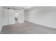 Carpeted bedroom with walk-in closet and view of ensuite bathroom at 5908 Sw 115 Street Rd, Ocala, FL 34476