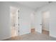 Neutral bedroom with carpeted floor leading to bright bathroom and walk-in closet at 5908 Sw 115 Street Rd, Ocala, FL 34476