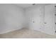 Bright bedroom featuring neutral carpet and white doors at 5908 Sw 115 Street Rd, Ocala, FL 34476