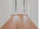 Interior view of the front door with wood flooring at 5908 Sw 115 Street Rd, Ocala, FL 34476
