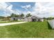Nice view of the community with manicured lawn and lengthy driveway at 5908 Sw 115 Street Rd, Ocala, FL 34476