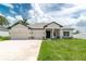 Beautiful single-Gathering home with a three car garage and well-manicured lawn at 5908 Sw 115 Street Rd, Ocala, FL 34476