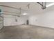 Large garage with a utility area, including a water heater, and ample space for parking and storage at 5908 Sw 115 Street Rd, Ocala, FL 34476